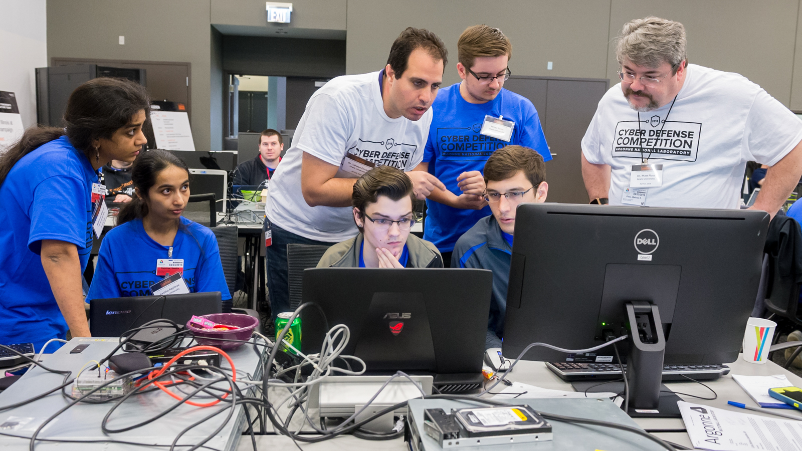 Members of the team from Lewis University work to defend their virtual grid system from attack at the first annual Argonne Collegiate Cyber Defense Competition