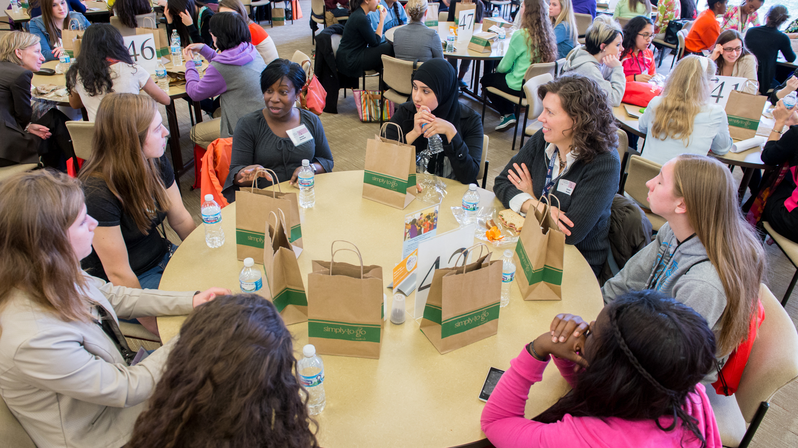 Argonne's Andrea Viel (center left) discusses science and tech career options with high school girls at a roundtable during Argonne's 27th annual Science Careers in Search of Women conference last year.