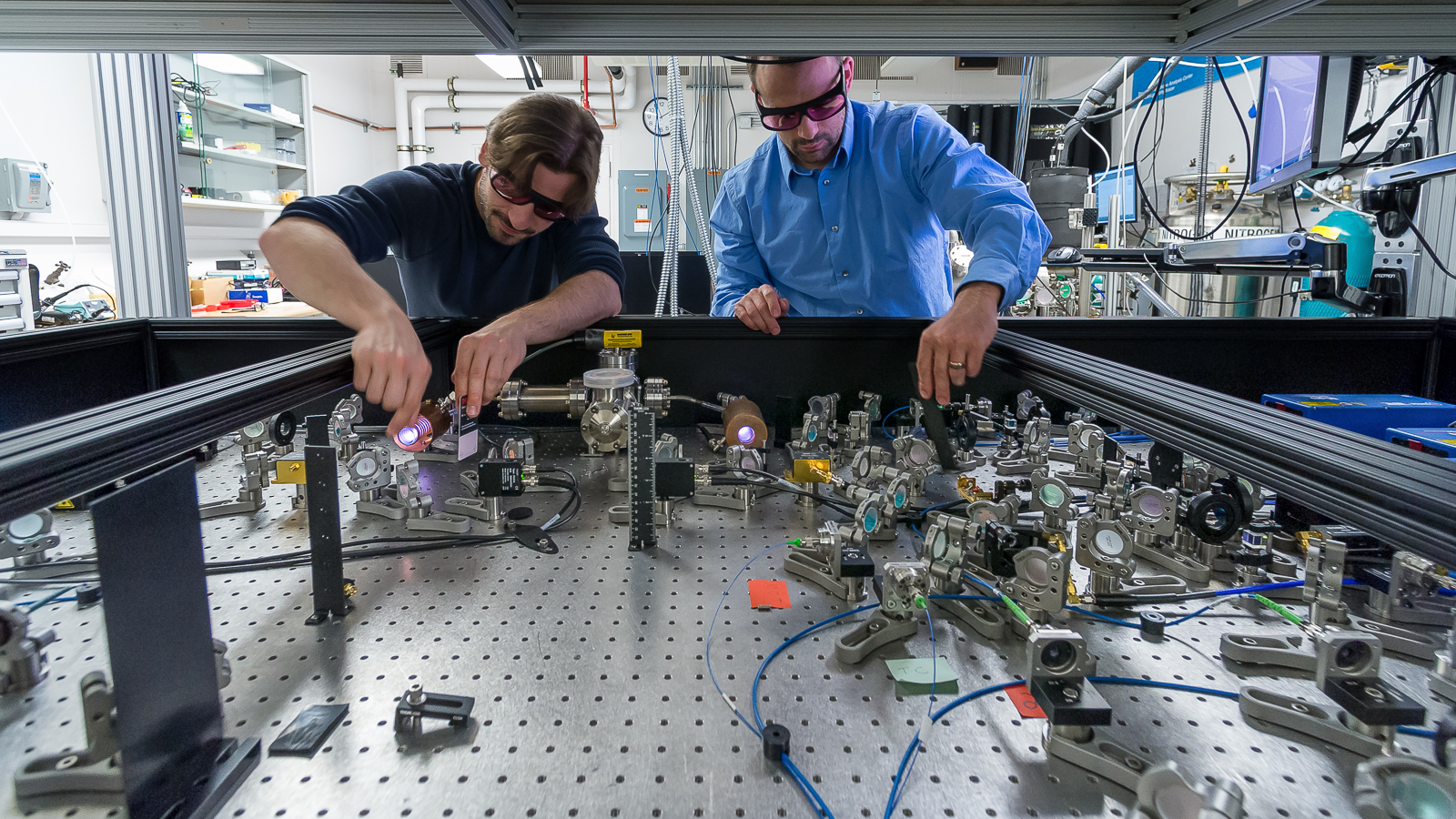 Argonne assistant physicist, Michael Bishof, aligns lasers used to trap and detect single atoms in Argonne’s Trace Radioisotope Analysis Center (TRACER). (Image by Mark Lopez, Argonne National Laboratory.)