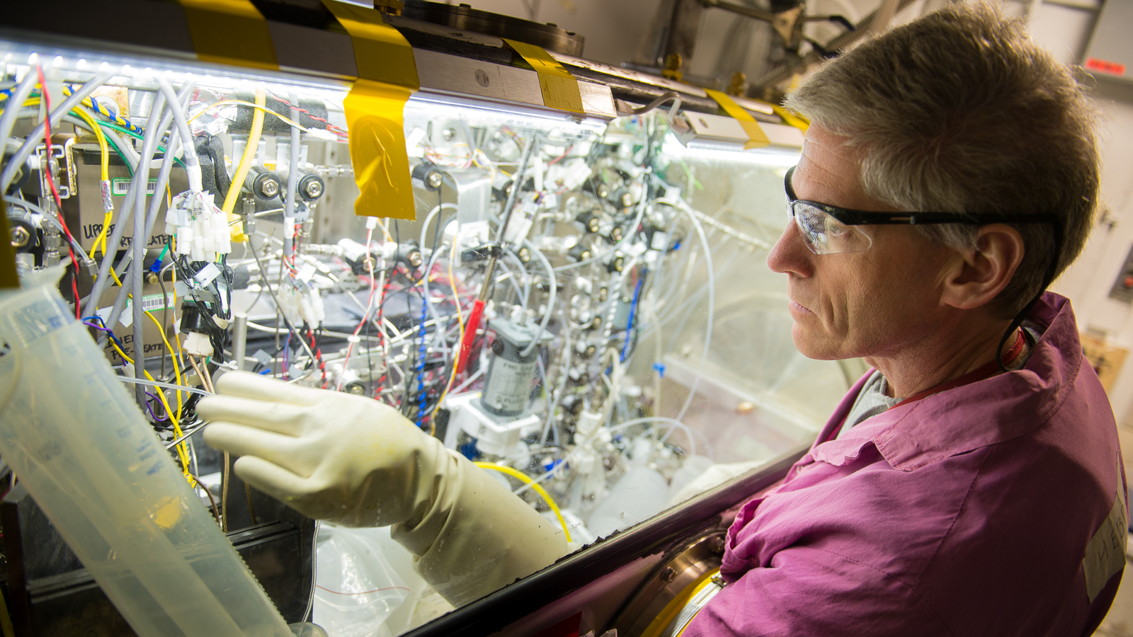 Scientific associate James Byrnes performs maintenance on a remote system that is used to recover molybdenum-99 from an irradiated target in a process recently demonstrated by Argonne. The operation is performed remotely due to high radiation fields in the target. (Photo by Wes Agresta.)