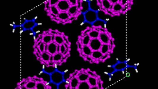 Simulated structures showing the starting material of carbon-60 “buckyballs” (magenta) and m-xylene solvent (blue) before being compressed. (Credit: Carnegie Institute of Washington)