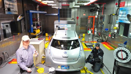 In this split screen image, Argonne engineer Henning Lohse-Busch evaluates an electric vehicle under extreme hot (left) and cold conditions (right). The Advanced Powertrain Research Facility’s Environmental Test Cell is equipped to evaluate vehicles and their components at a temperature range of 20°F to 95°F.