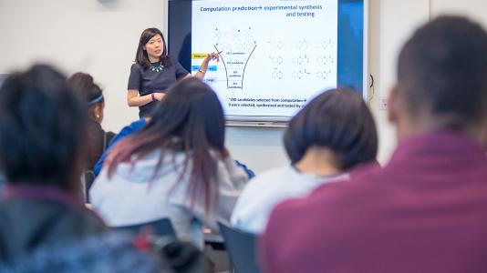 Lei Cheng, Argonne assistant chemist, presents to Chicago-area students. Cheng received the 40 Under 40 Award from Midwest Energy News in September. (Image by Argonne National Laboratory.)