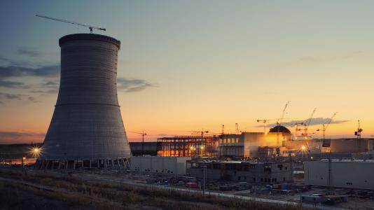 nuclear reactor in foreground at sunset