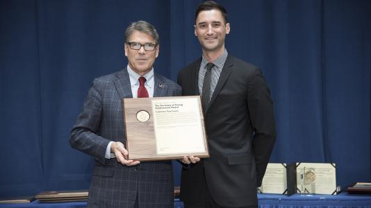 Lawrence Paul Lewis receives the Secretary of Energy’s Achievement Award from Secretary of Energy Rick Perry at the Secretary’s Honor Awards ceremony in Washington, D.C., on August 29. (Image by U.S. Department of Energy.)