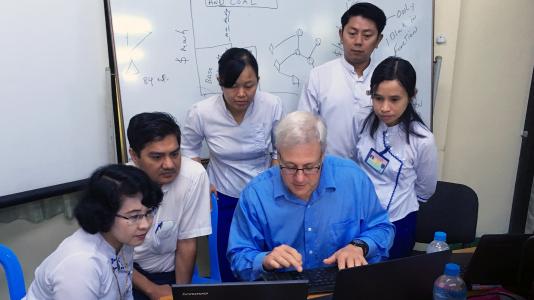 Argonne National Laboratory’s Tom Veselka (center, in blue shirt) demonstrates use of GTMax during a training class in Southeast Asia.
