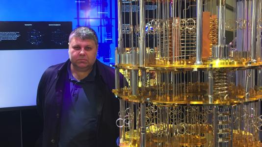 Dr. Alexeev with a model of an IBM Q quantum computer