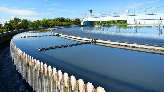 Photograph of edge of circular wastewater treatment plant. (Image by Shutterstock/M-Production.)
