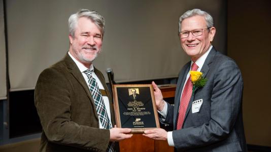 Argonne Director Paul Kearns (right) accepts the John E. Christian Distinguished Alumnus Award from Aaron Bowman, head of the Purdue University School of Health Sciences.