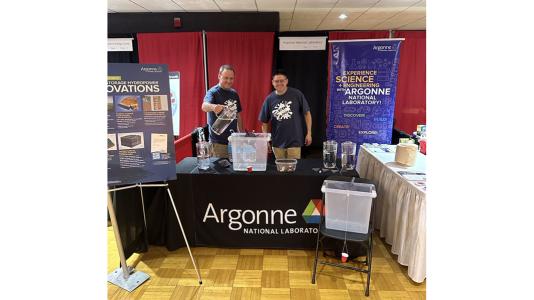 Researchers at a booth involved in a STEM learning program.