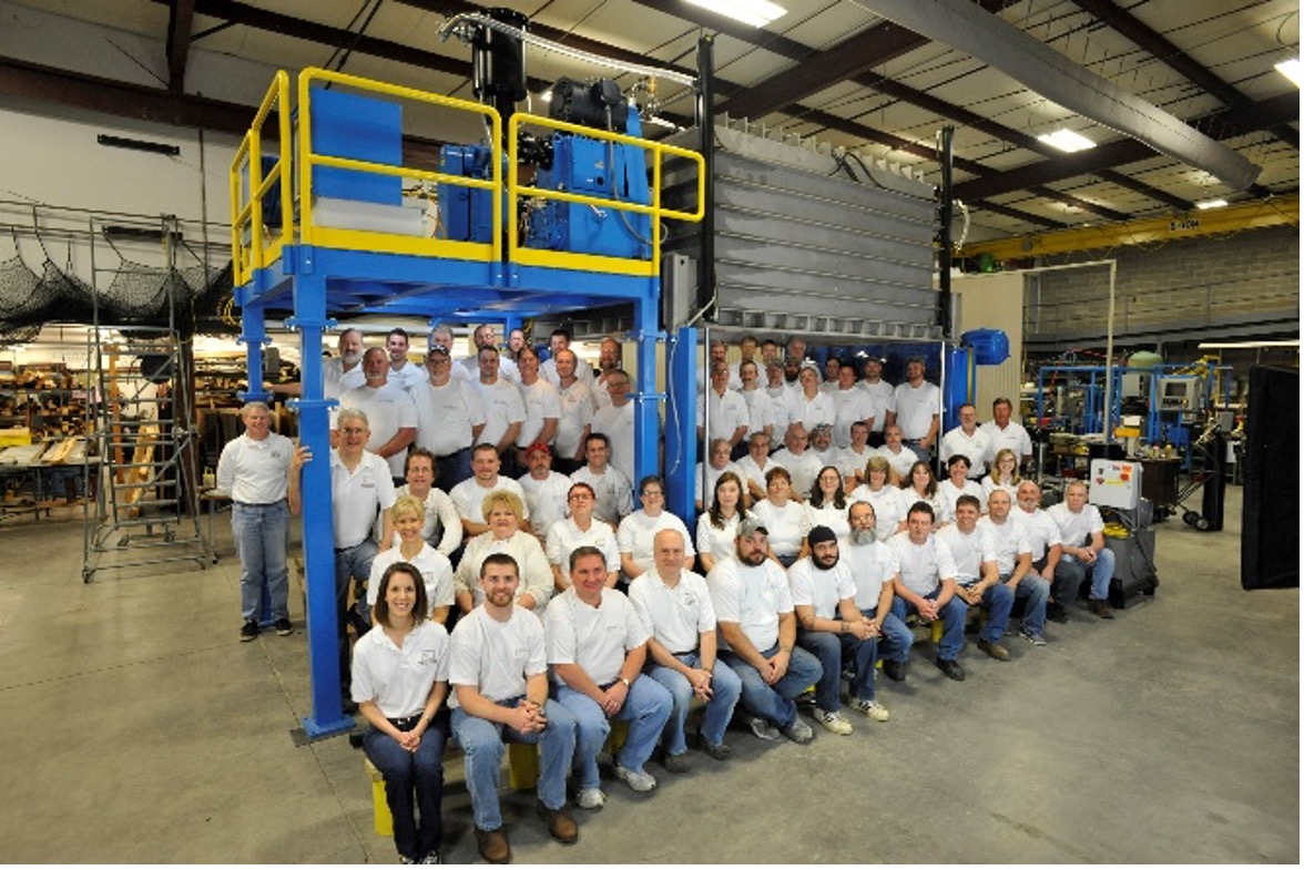 VTI group photo in industrial building